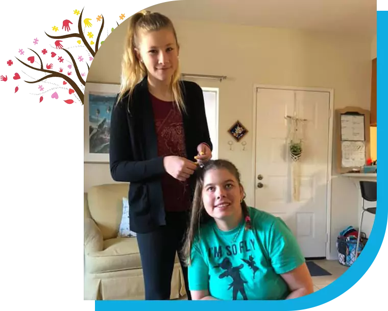 A girl and her friend are getting their hair cut.